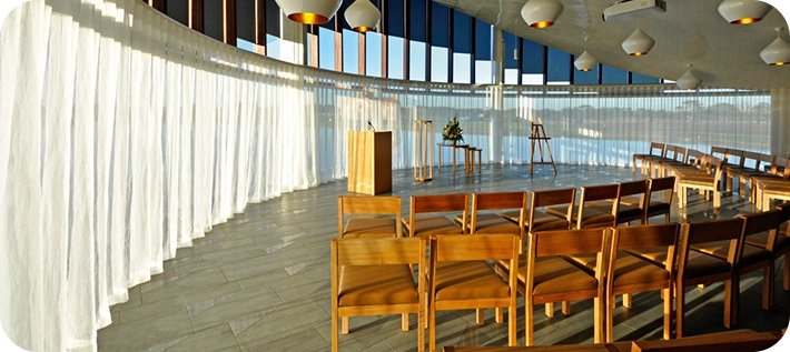 Sheer white curtains in a serene ceremonial room