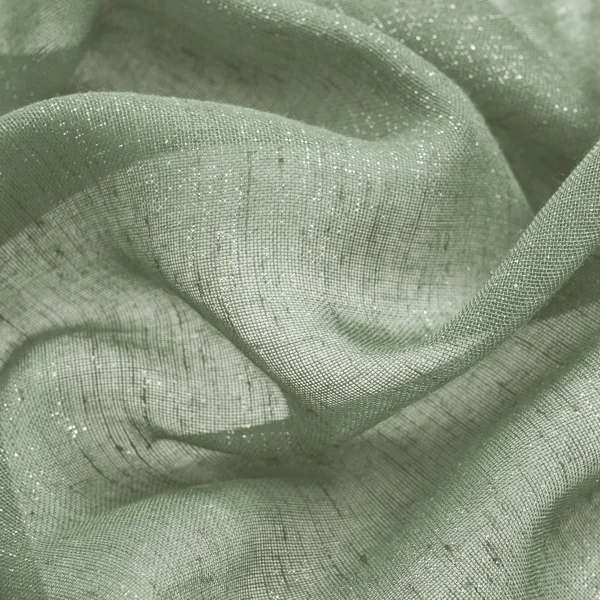 Shimmering sage green fabric in soft ripples