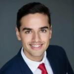 Man in suit and tie smiling